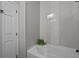Bathroom with soaking tub and modern gray tile at 385 Alcove Dr, Groveland, FL 34736