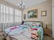 Spacious bedroom with large windows and decorative bedding at 385 Alcove Dr, Groveland, FL 34736