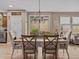 Open concept dining area with chandelier and view to backyard at 385 Alcove Dr, Groveland, FL 34736