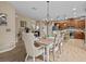 Bright dining room features a large table and chandelier at 385 Alcove Dr, Groveland, FL 34736