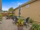 Private patio with table and chairs, perfect for outdoor dining at 385 Alcove Dr, Groveland, FL 34736