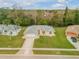 Single-Gathering home with driveway and grassy yard at 4572 Woodcove Dr, Port Orange, FL 32127