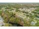Wide aerial view of neighborhood and waterfront at 4572 Woodcove Dr, Port Orange, FL 32127