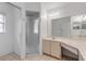 Bathroom features a shower stall and updated vanity at 4572 Woodcove Dr, Port Orange, FL 32127