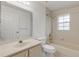Clean bathroom with tub, toilet and vanity at 4572 Woodcove Dr, Port Orange, FL 32127