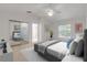 Spacious bedroom with mirrored closet doors and large window at 4572 Woodcove Dr, Port Orange, FL 32127