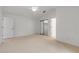 Bright bedroom with ceiling fan and mirrored closet doors at 4572 Woodcove Dr, Port Orange, FL 32127