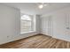 Bedroom with arched window, ceiling fan and closet at 4572 Woodcove Dr, Port Orange, FL 32127