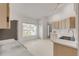 Kitchen with light wood cabinets, white countertops, and stainless steel appliances at 4572 Woodcove Dr, Port Orange, FL 32127