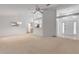 Bright living room with vaulted ceilings and access to a sunroom at 4572 Woodcove Dr, Port Orange, FL 32127