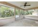Spacious screened porch overlooking lush green backyard at 4572 Woodcove Dr, Port Orange, FL 32127