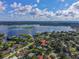 An aerial view with property pin showcases the beautiful home near the picturesque lake at 4914 Gran Lac Ave, Belle Isle, FL 32812
