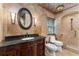 Elegant bathroom boasts granite countertops, custom vanity, and a tiled shower, creating a luxurious spa-like retreat at 4914 Gran Lac Ave, Belle Isle, FL 32812