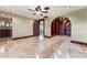 Bedroom with unique design featuring custom closet, elegant archways, and beautiful tile flooring, creating a luxury atmosphere at 4914 Gran Lac Ave, Belle Isle, FL 32812
