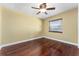 Bedroom featuring hardwood floors, ceiling fan, one window, and neutral walls at 4914 Gran Lac Ave, Belle Isle, FL 32812