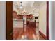 Kitchen features stainless steel appliances, dark wood cabinets, granite countertops, and hardwood floors at 4914 Gran Lac Ave, Belle Isle, FL 32812