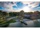 An aerial view shows private lake access with boat ramp and picnic space at 4914 Gran Lac Ave, Belle Isle, FL 32812