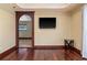 The living room features tile floors, recessed lighting, arched doorway, and modern tv at 4914 Gran Lac Ave, Belle Isle, FL 32812