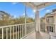 Screened balcony with wooded views and partial community view at 588 Brantley Terrace Way # 303, Altamonte Springs, FL 32714