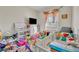 bedroom with crib, toys, and ample closet space at 588 Brantley Terrace Way # 303, Altamonte Springs, FL 32714