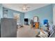 Spacious bedroom with TV, gaming chair, and ample closet space at 588 Brantley Terrace Way # 303, Altamonte Springs, FL 32714