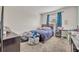 Cozy bedroom with double bed, window, and carpeted floor at 588 Brantley Terrace Way # 303, Altamonte Springs, FL 32714