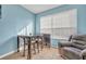 Small dining area with table and chairs near living room at 588 Brantley Terrace Way # 303, Altamonte Springs, FL 32714