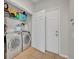 Laundry room with washer, dryer, and additional storage at 588 Brantley Terrace Way # 303, Altamonte Springs, FL 32714