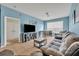 Living room with sectional sofa, TV and dining table at 588 Brantley Terrace Way # 303, Altamonte Springs, FL 32714