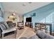 Living room with gray sectional, dining table and kitchen view at 588 Brantley Terrace Way # 303, Altamonte Springs, FL 32714