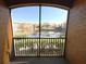 Enjoy a scenic view of the lake and community from this private balcony at 6149 Metrowest Blvd # 106, Orlando, FL 32835