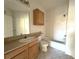 Clean bathroom with a bathtub, toilet, and vanity at 6149 Metrowest Blvd # 106, Orlando, FL 32835