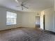 Spacious bedroom with carpeted floors and large window at 6149 Metrowest Blvd # 106, Orlando, FL 32835