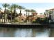 Relax by the community pool surrounded by palm trees and Spanish-style architecture at 6149 Metrowest Blvd # 106, Orlando, FL 32835