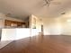 Kitchen with wood cabinets and a breakfast bar at 6149 Metrowest Blvd # 106, Orlando, FL 32835