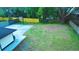 Expansive backyard with a basketball hoop, offering plenty of room for recreation at 630 Sailfish Rd, Winter Springs, FL 32708
