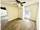 Neutral bedroom featuring a ceiling fan, closet, and natural light through the window at 630 Sailfish Rd, Winter Springs, FL 32708