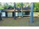 Charming single-story home with stone accents, black trim, and a welcoming front porch at 630 Sailfish Rd, Winter Springs, FL 32708