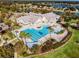 Resort-style pool and community clubhouse viewed from above at 7836 Crosswinds Way, Mount Dora, FL 32757