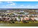 Aerial view highlighting a lakefront home's location within a community at 7836 Crosswinds Way, Mount Dora, FL 32757