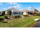 Landscaped backyard with a patio and access to the water at 7836 Crosswinds Way, Mount Dora, FL 32757