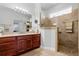 Large bathroom with walk-in shower, vanity, and tile floors at 7836 Crosswinds Way, Mount Dora, FL 32757