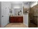 Bathroom features a walk-in shower and modern vanity at 7836 Crosswinds Way, Mount Dora, FL 32757