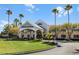 Attractive community clubhouse with palm trees at 7836 Crosswinds Way, Mount Dora, FL 32757