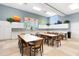 Community room with tables and chairs at 7836 Crosswinds Way, Mount Dora, FL 32757
