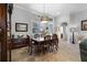 Bright dining room with wood table and access to kitchen at 7836 Crosswinds Way, Mount Dora, FL 32757