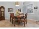Spacious dining room with wood table and six chairs at 7836 Crosswinds Way, Mount Dora, FL 32757