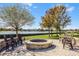 Enjoy lake views from this fire pit area at 7836 Crosswinds Way, Mount Dora, FL 32757
