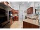 Modern kitchen with stainless steel appliances and wood cabinets at 7836 Crosswinds Way, Mount Dora, FL 32757