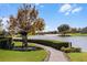 Community park with a lake view and walking path at 7836 Crosswinds Way, Mount Dora, FL 32757